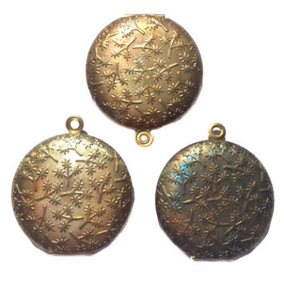 vintage antiqued brass round locket with twig texture